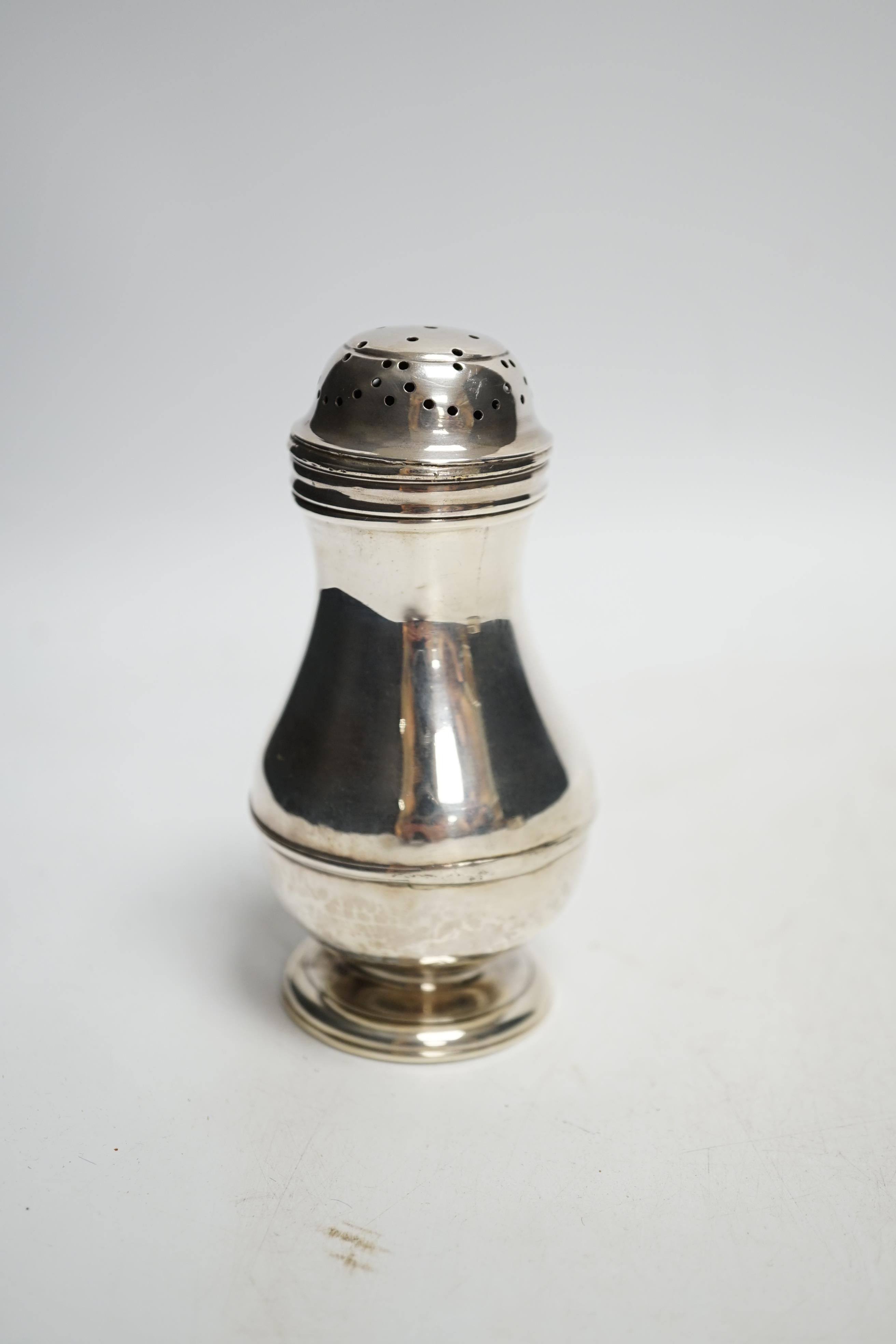 An early George II silver baluster pepperette, Ralph Maidman, London, 1732, 11cm, 83 grams. Condition - poor